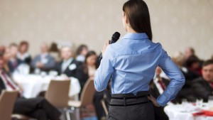 Woman speaking to a crowd.