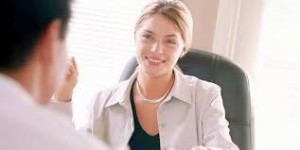 A smiling woman meeting face to face.