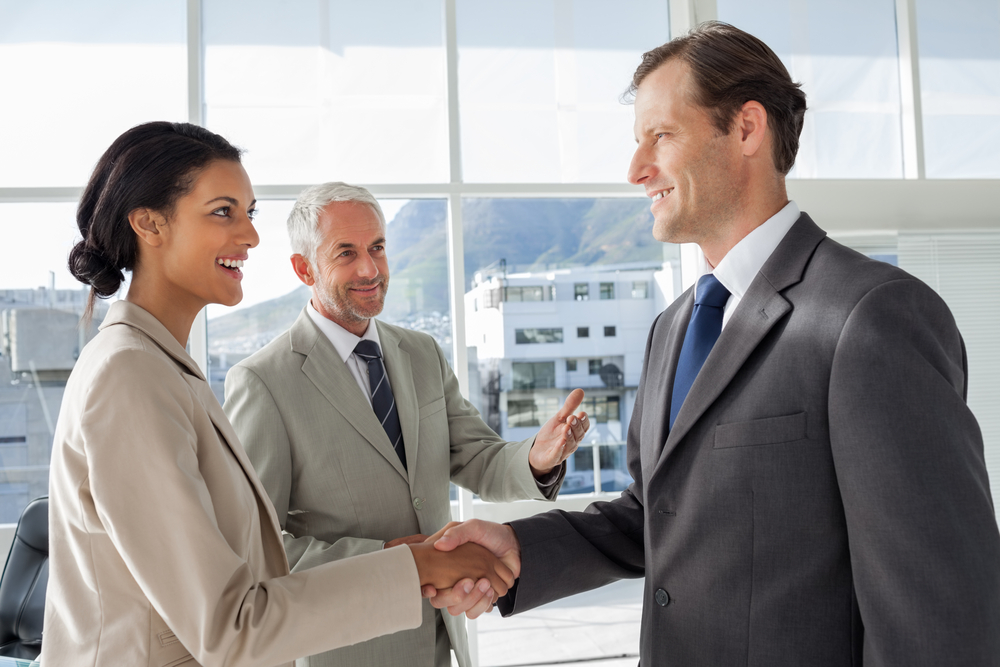 Two people shaking hands.