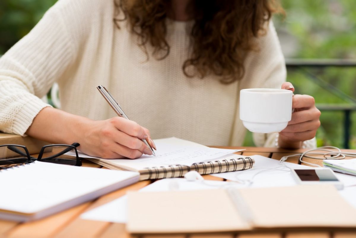 Woman writing.