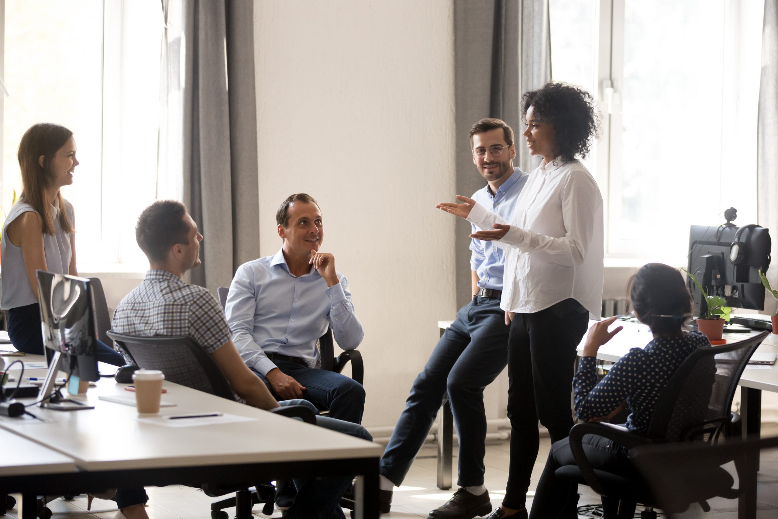 A woman is leading her team with empathy, showing great emotional intelligence.