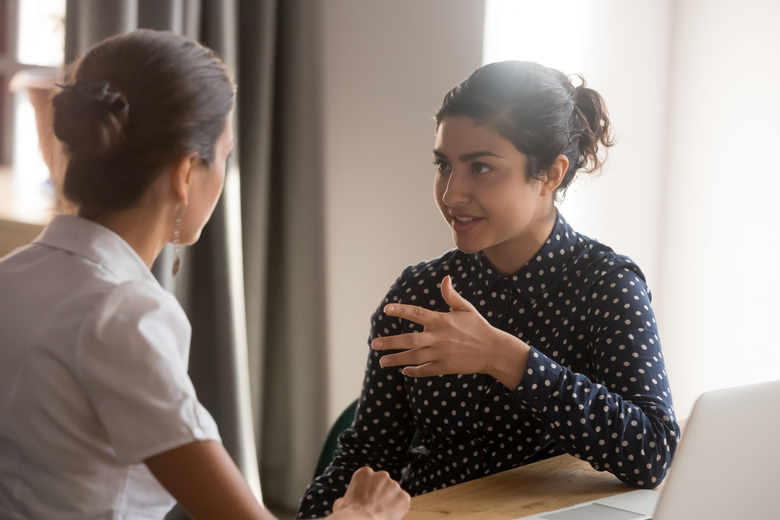 A fundraiser is having a courageous conversation with a colleague.