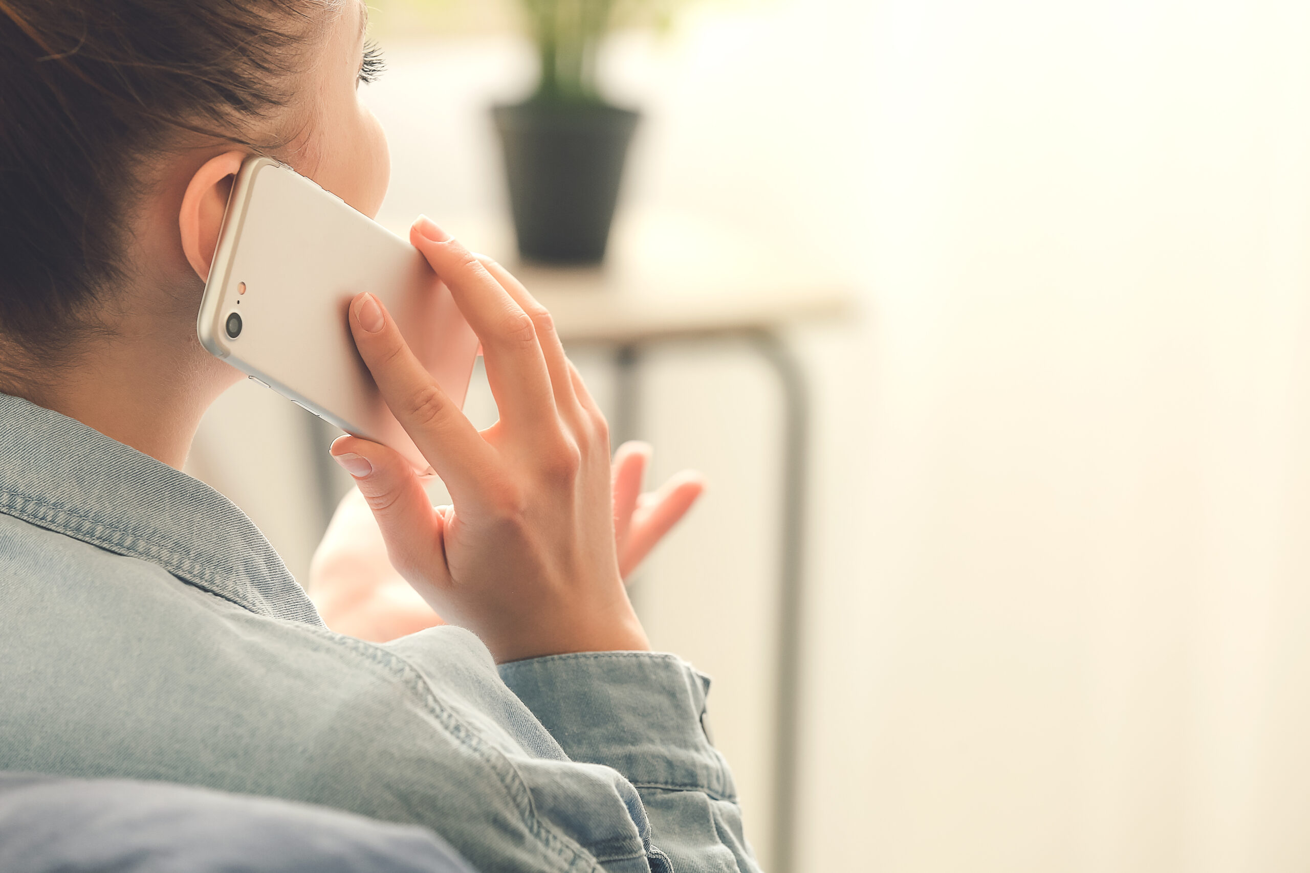 Woman talking on phone [The Worst Way to Start a Conversation with a Donor]