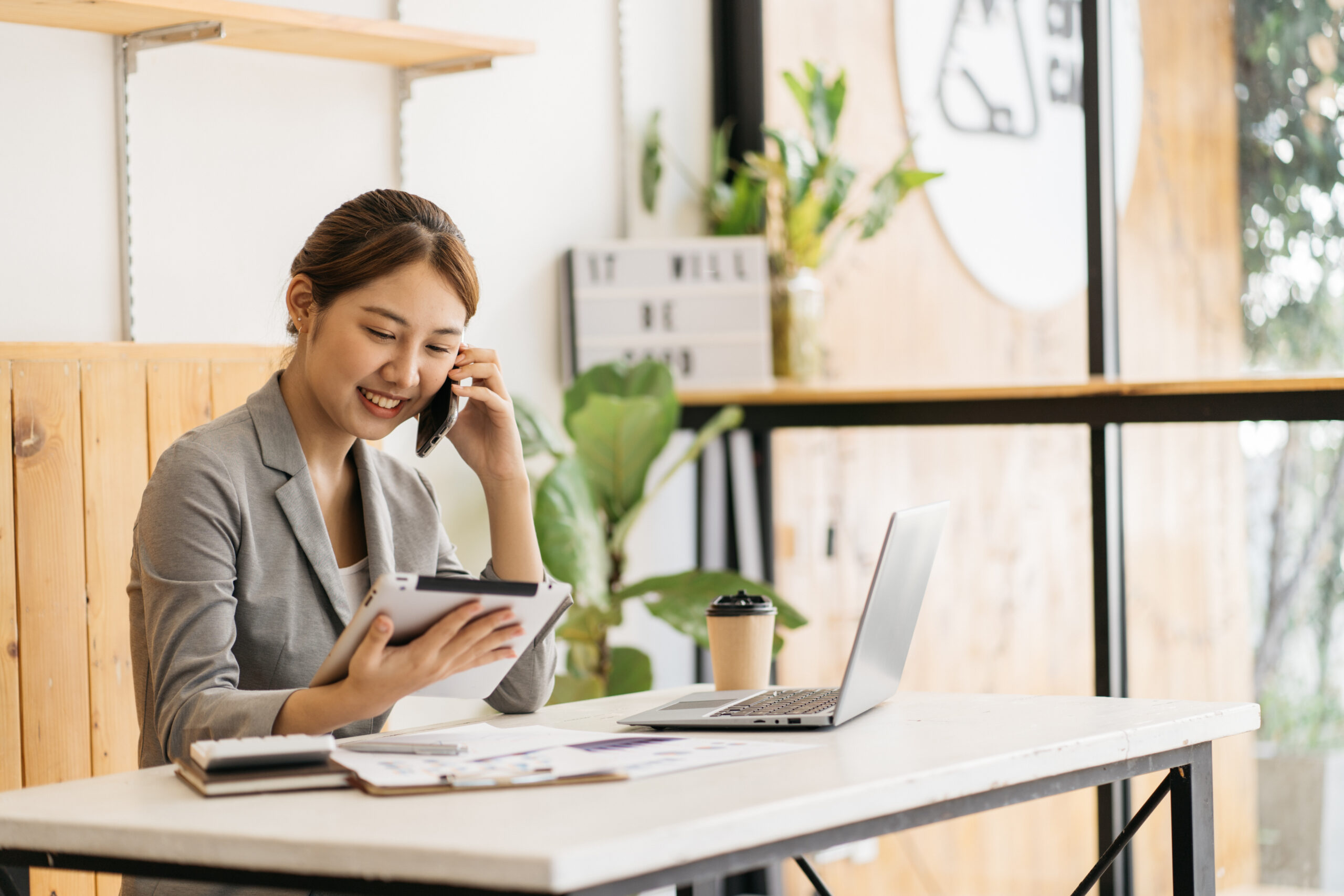 Young business woman smiling on the phone.[Want to Build Solid Donor Relationships? Connect with Your Team!]