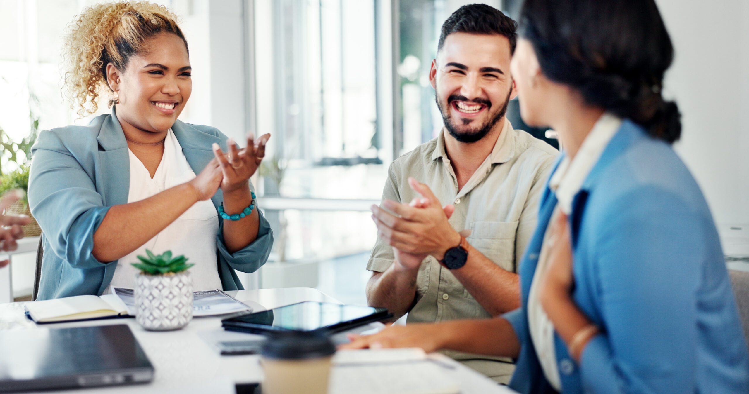 Manager and staff clapping in celebration of achievement. [Can You Truly Honor Your Donors without a Strong Mid-Level Program?]