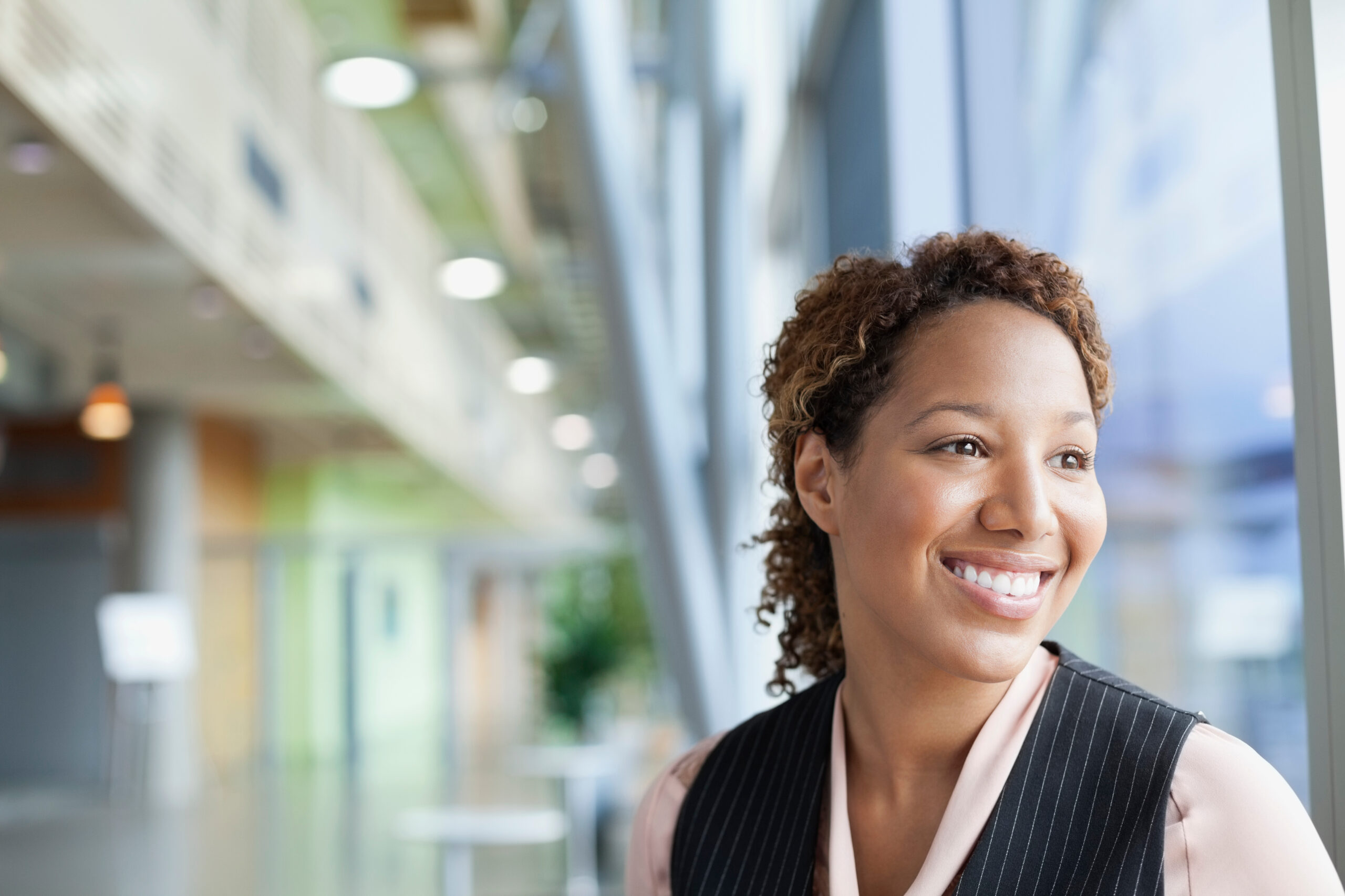 Confident, daydreaming woman looks out window. [Do You Have What it Takes to Get a Transformational Gift?]