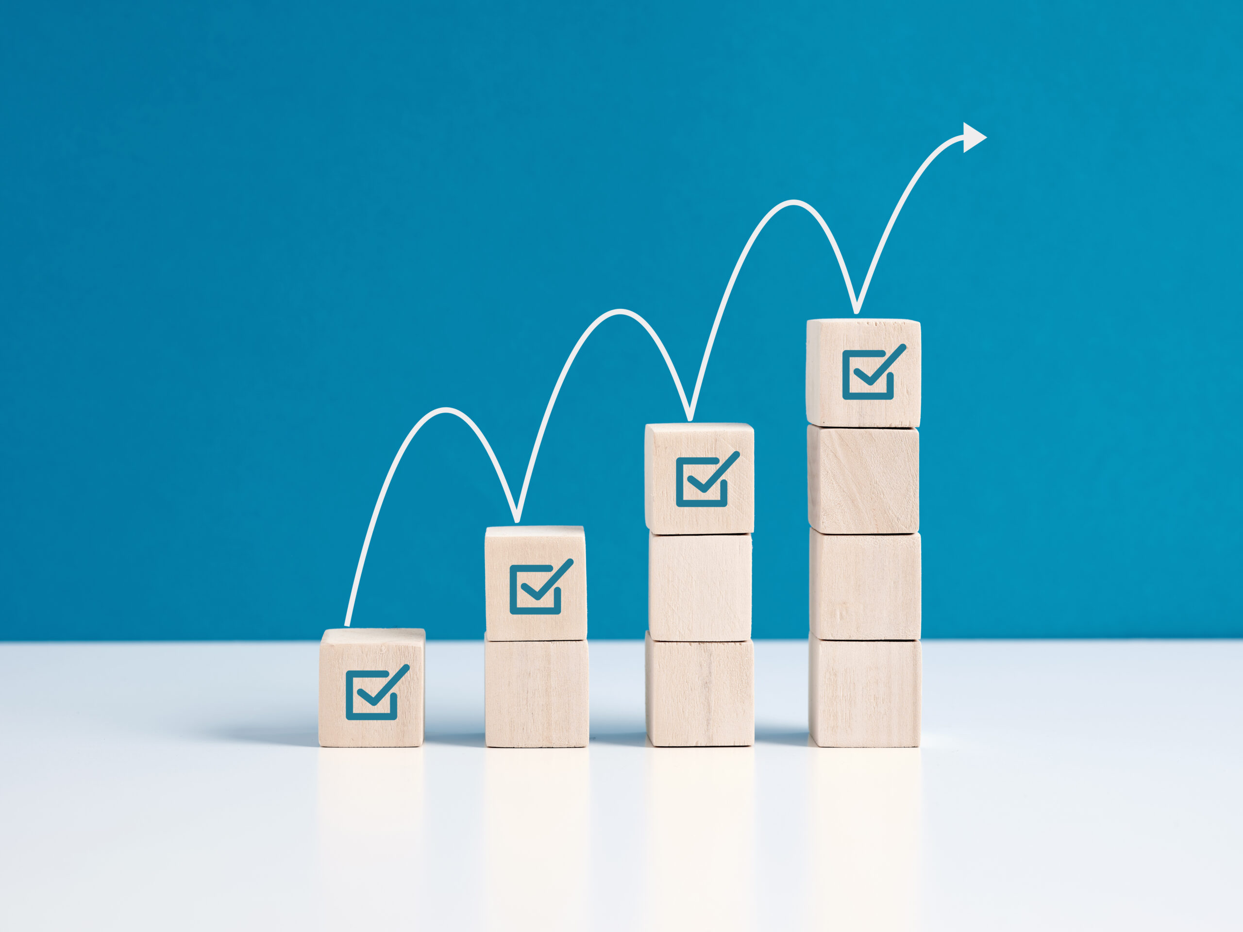 Stack of blocks with upward arrow demonstrating task completion. [Ten Reasons Your Fundraising Is Not Working and What to Do About It]