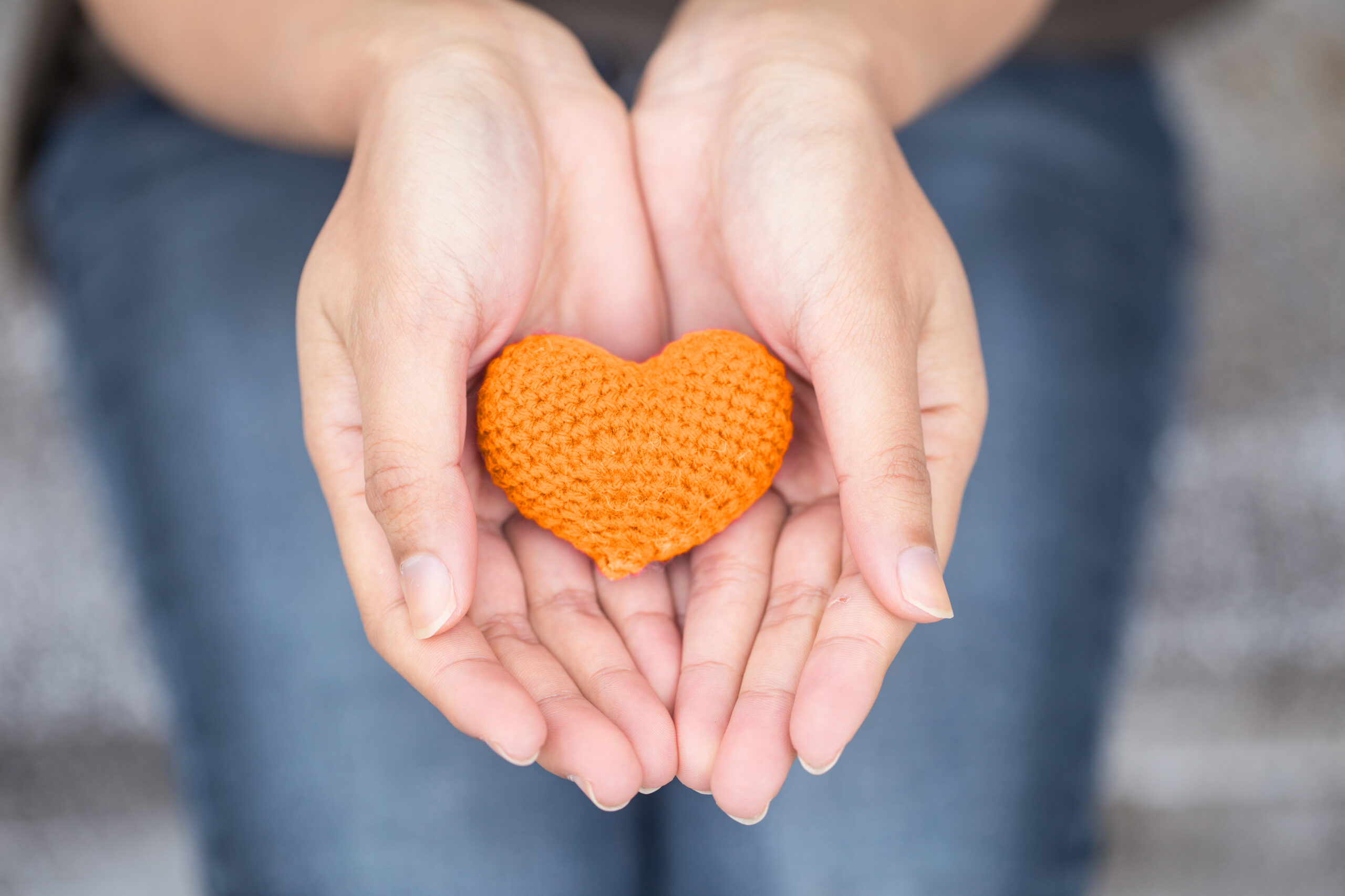 Hands holding heart. [Who has loved you into being?]